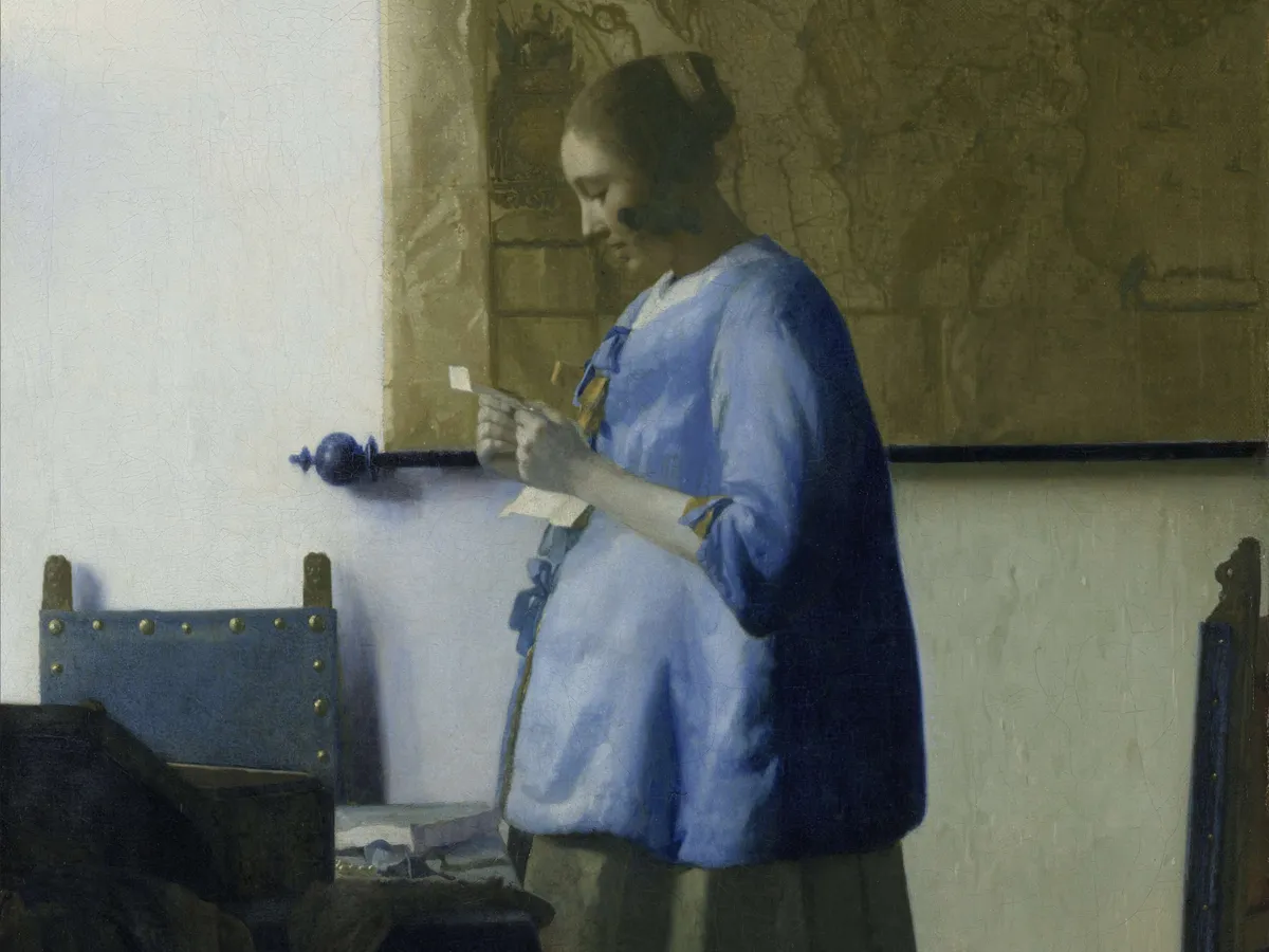 Vermeer's painting of a woman in blue reading a letter by a window