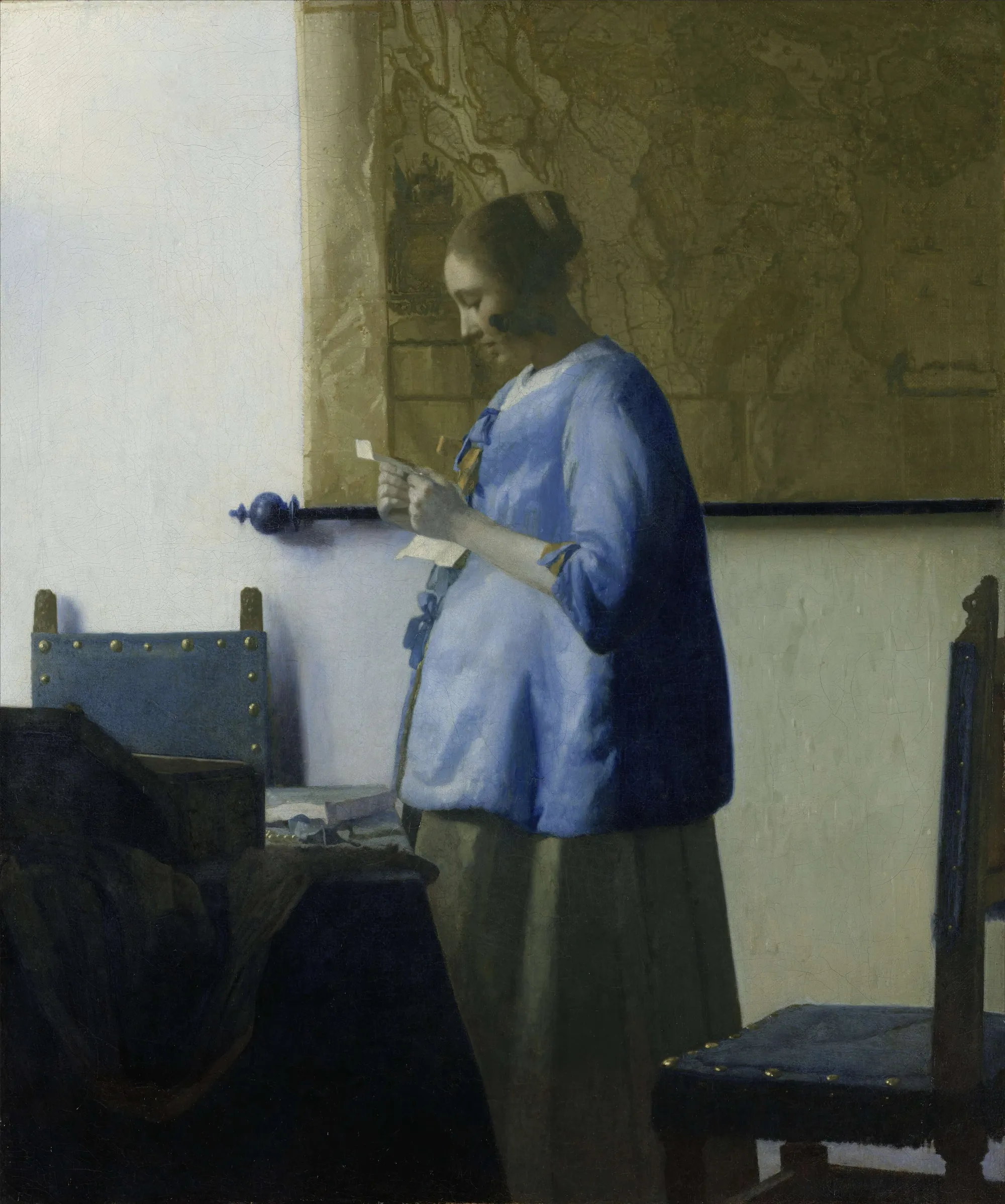 Vermeer's painting of a woman in blue reading a letter by a window