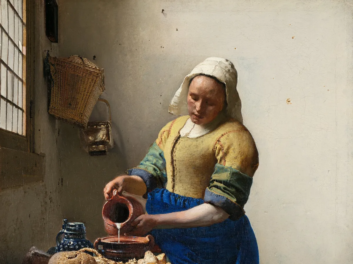 Vermeer's milkmaid pouring milk in a quiet kitchen