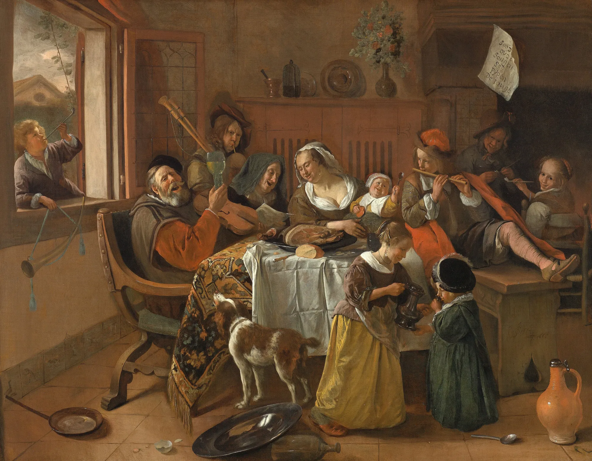 Jan Steen's crowded family scene: a household singing and toasting around a table
