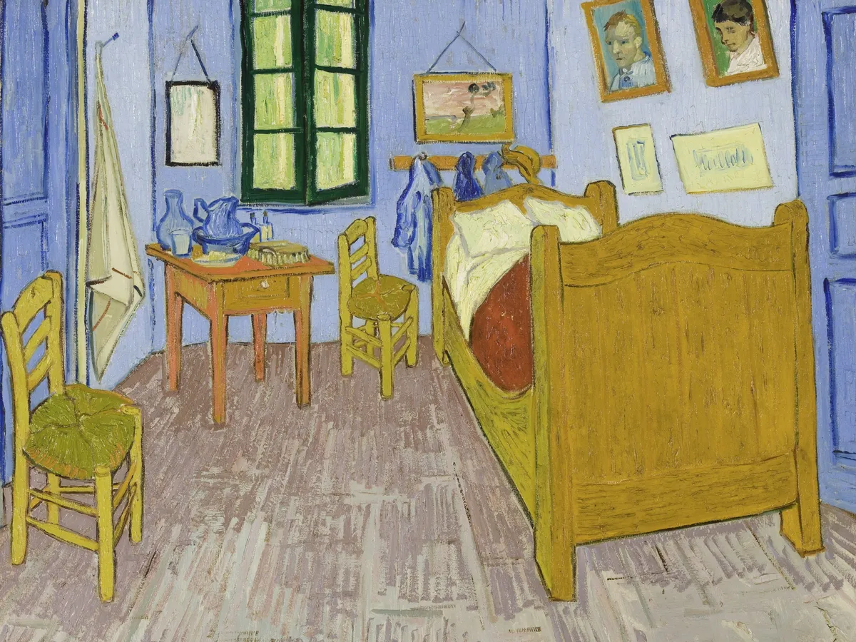 Van Gogh's bedroom in Arles: wooden bed, two chairs, blue walls